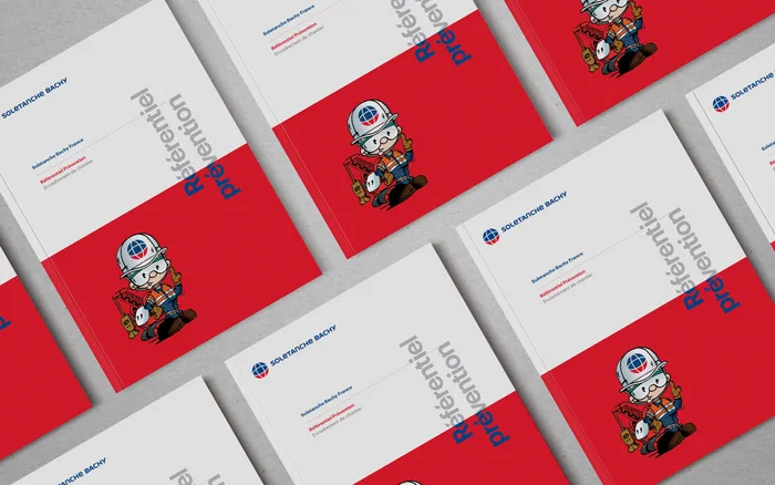Red and white safety brochures with mascot, designed by the Comhit branding agency in Paris.