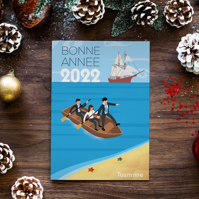 Tarjeta de felicitación de 2022 con un equipo en un barco, diseñada por Comhit, una agencia de branding de París.