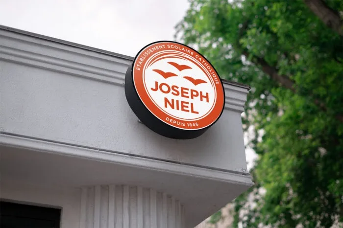 Modern circular design sign for Joseph Niel, a Catholic school. Branding by Comhit, a Paris-based agency.